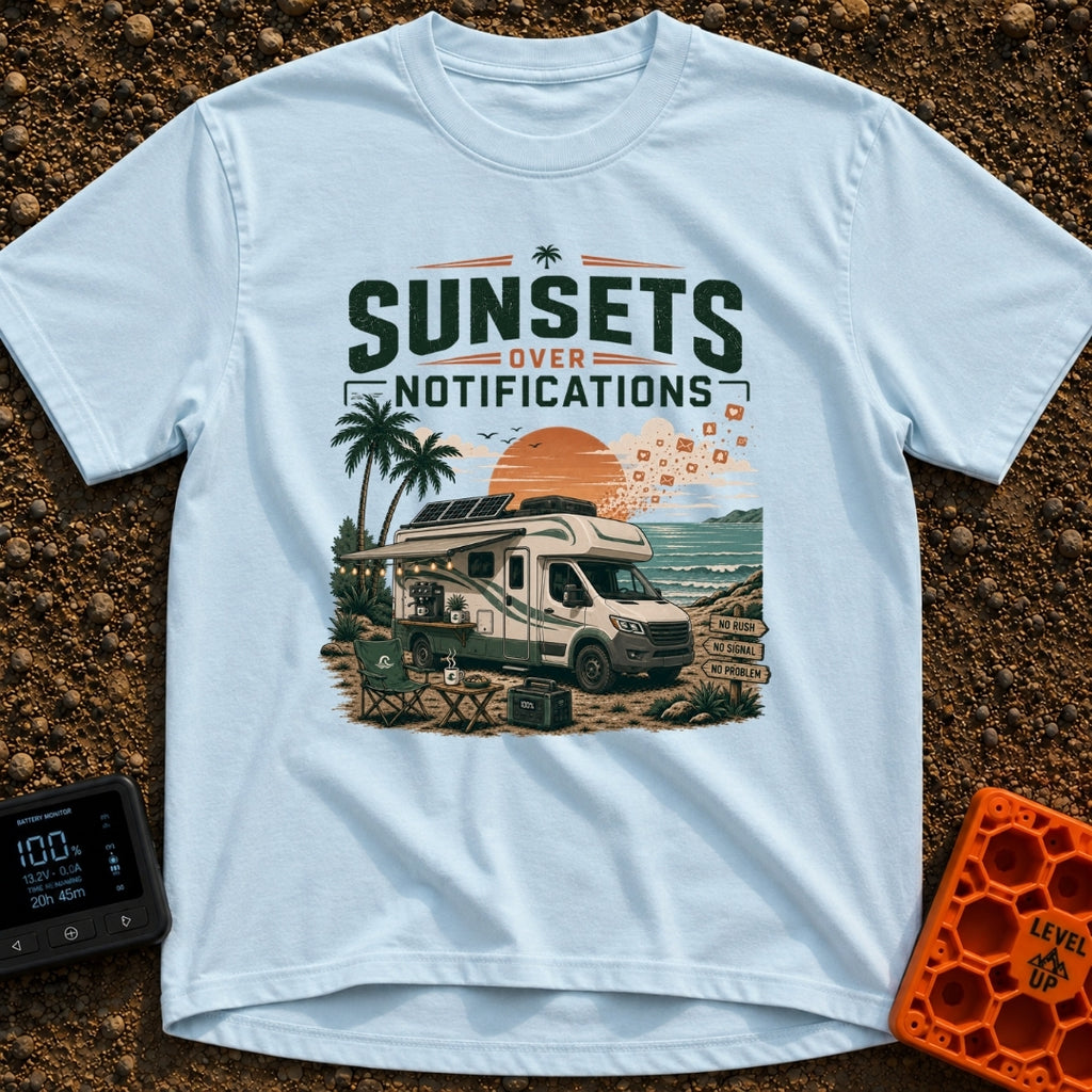 Sunsets Over Screens - T-Shirt in Chambray - An RV parked on a beach at sunset with solar panels on the roof, an awning...