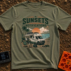 Sunsets Over Screens - T-Shirt in Moss - An RV parked on a beach at sunset with solar panels on the roof, an awning...