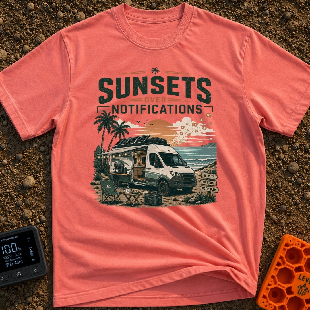 Sunsets Over Screens - T-Shirt in Watermelon - A camper van is parked on a beach at sunset with its side door open,...