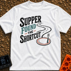 Shortcut To Supper - T-Shirt in White - Text reading "SUPPER FOUND THE SHORTCUT" alongside a graphic of a winding road...