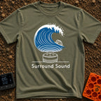 Making Sound Waves - T-Shirt in Moss - A graphic showing a small smart speaker emitting a massive, crashing ocean wave,...