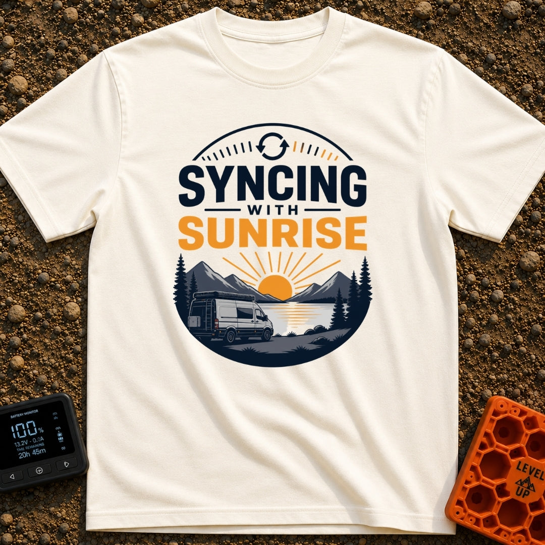 Rise And Sync - T-Shirt in Ivory - A circular badge design featuring a white camper van parked by a lake with mountains...