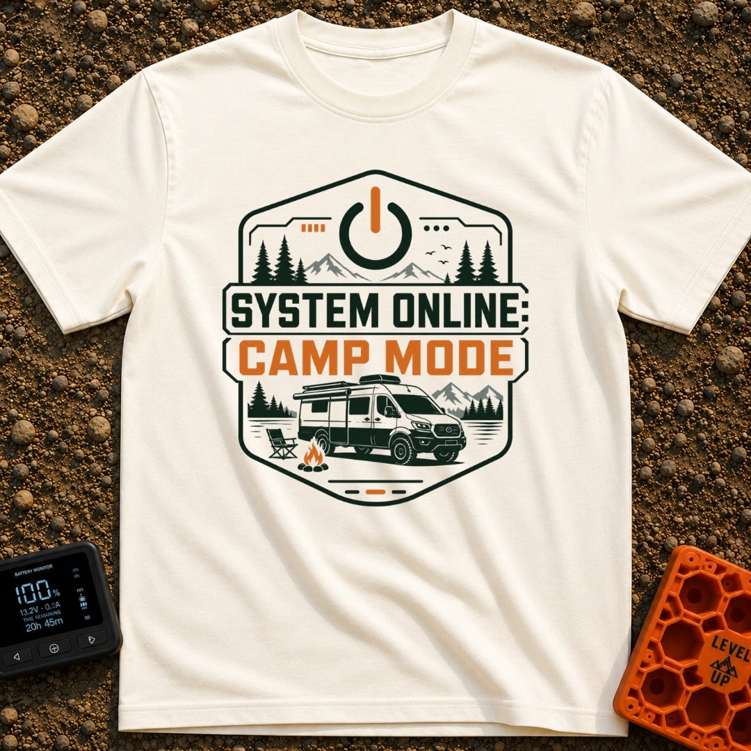 Camp Mode Activated - T-Shirt in Ivory - A badge-style illustration showing a camper van parked near a campfire and an...