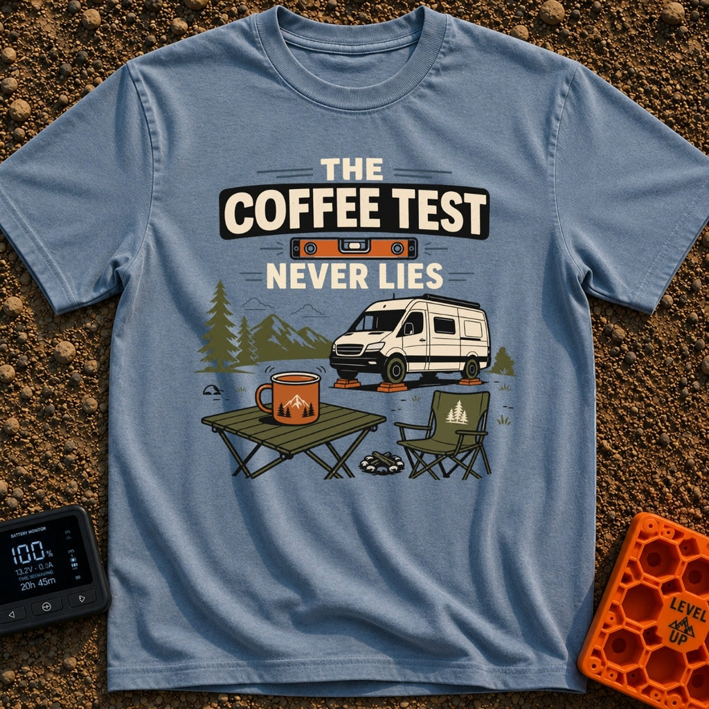 The Coffee Never Lies - T-Shirt in Blue Jean - An illustration of a camper van parked on leveling blocks in a mountain...