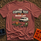 The Coffee Never Lies - T-Shirt in Brick - An illustration of a camper van parked on leveling blocks in a mountain...