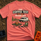 The Coffee Never Lies - T-Shirt in Watermelon - An illustration of a camper van parked on leveling blocks in a mountain...