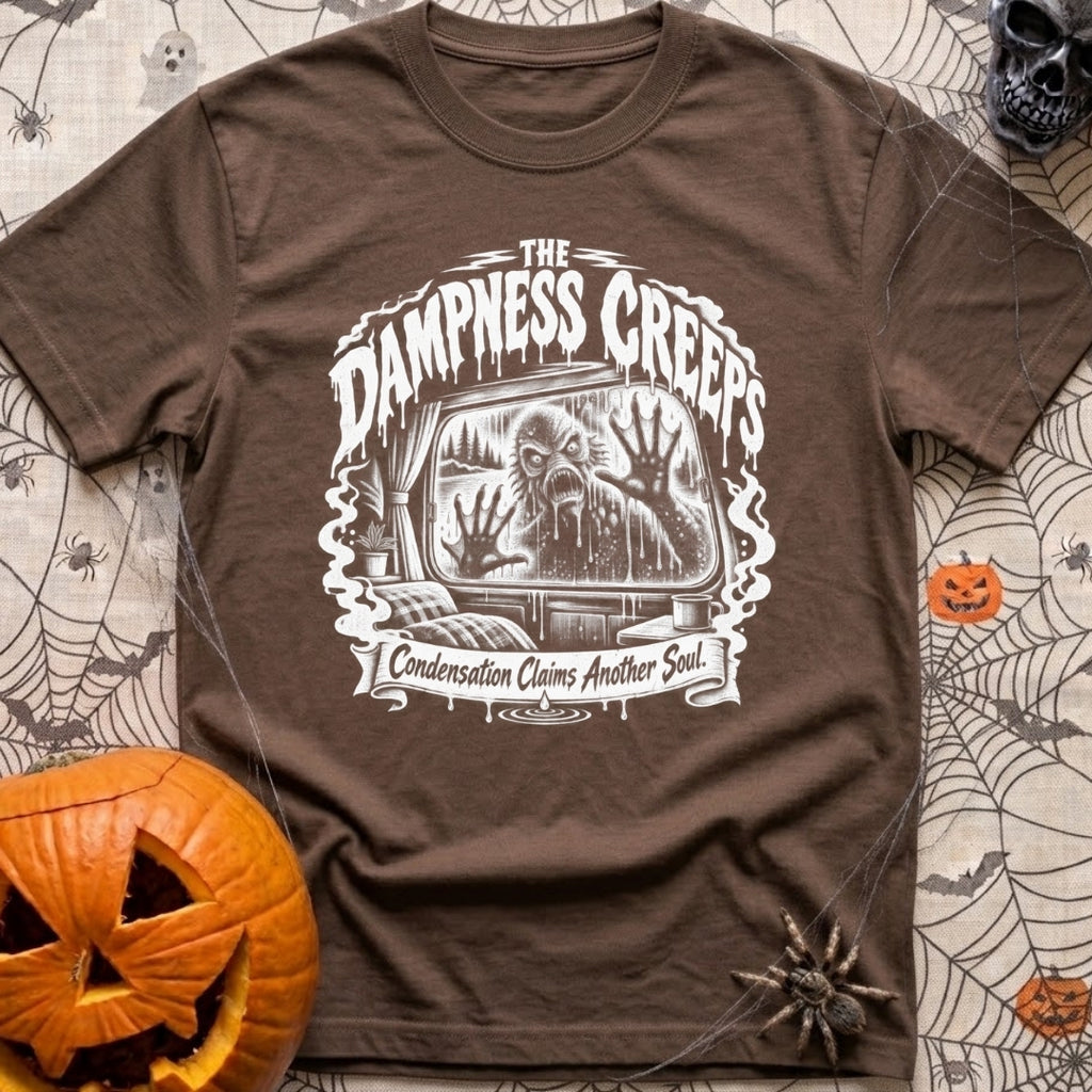 The Damp Creeps In - T-Shirt in Espresso - A black-and-white illustration of a swamp creature with webbed hands pressing...