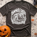 The Damp Creeps In - T-Shirt in Graphite - A black-and-white illustration of a swamp creature with webbed hands pressing...