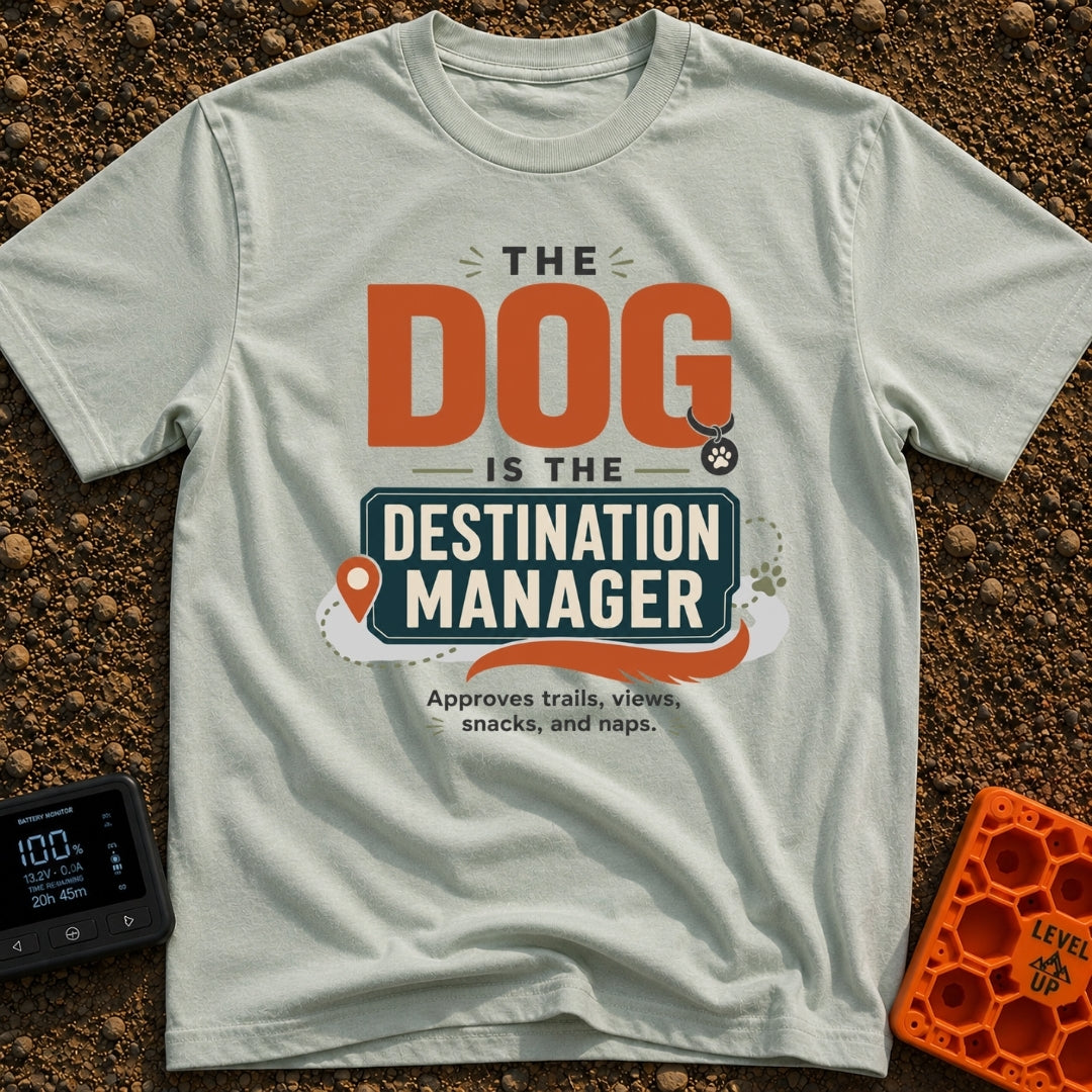 Pup Calls The Shots - T-Shirt in Bay - A typography-based design featuring the text "THE DOG IS THE DESTINATION MANAGER"...