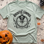 Dead Reckoning Society - T-Shirt in Bay - A black and white illustration of an ornate, vintage-style compass with a skull...