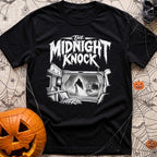 Fear The Knock - T-Shirt in Black - A black and white illustration looking from the inside of a camper out the window,...