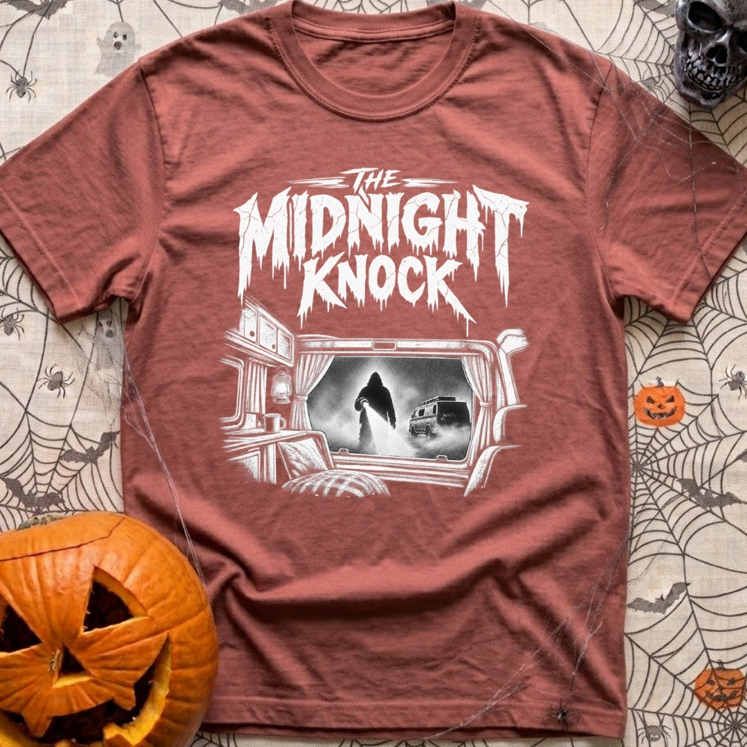Fear The Knock - T-Shirt in Brick - A black and white illustration looking from the inside of a camper out the window,...