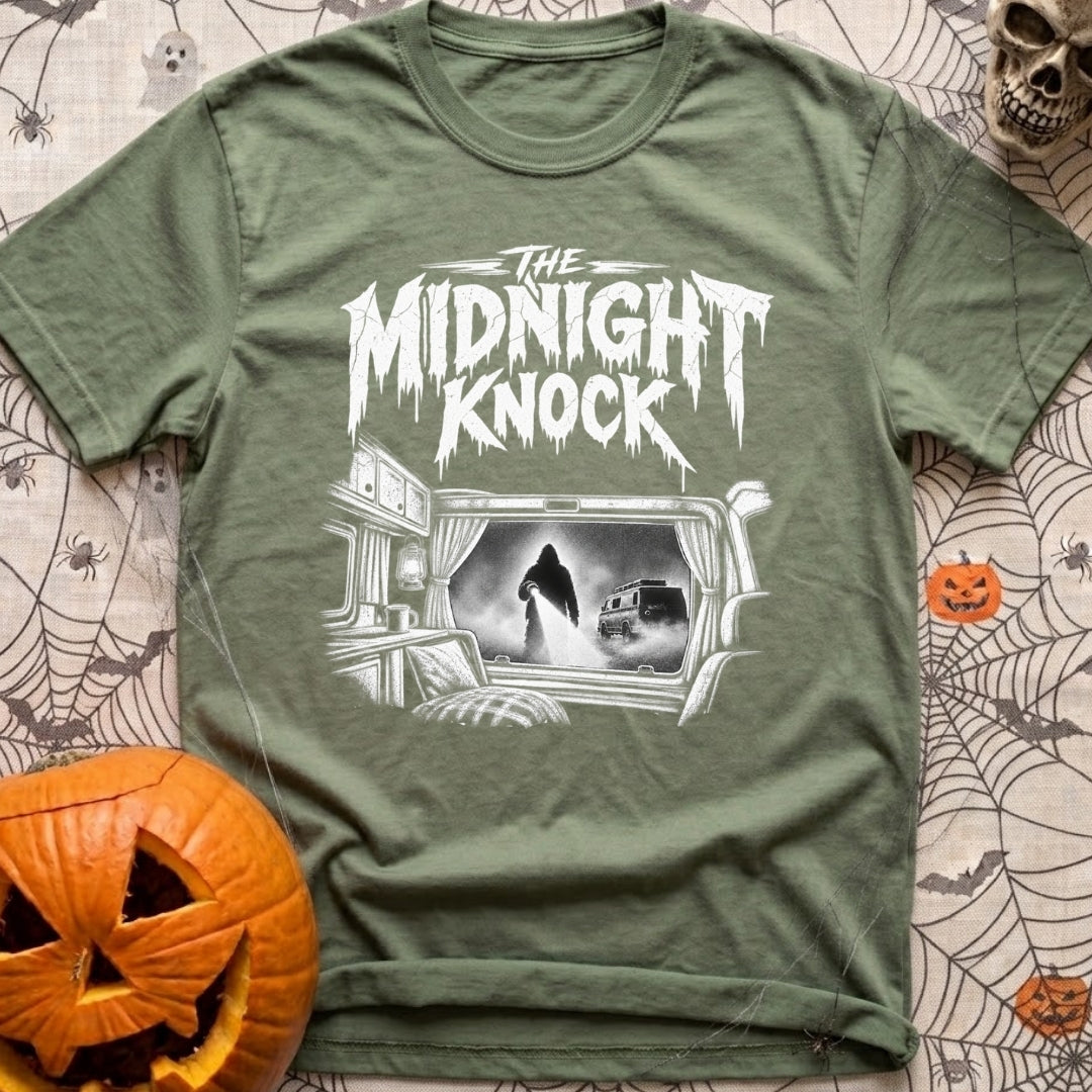 Fear The Knock - T-Shirt in Moss - A black and white illustration looking from the inside of a camper out the window,...