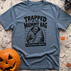 Rest In Fleece - T-Shirt in Blue Jean - A black and white illustration of an undead skeleton trapped inside a zipped-up...