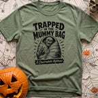 Rest In Fleece - T-Shirt in Moss - A black and white illustration of an undead skeleton trapped inside a zipped-up mummy...