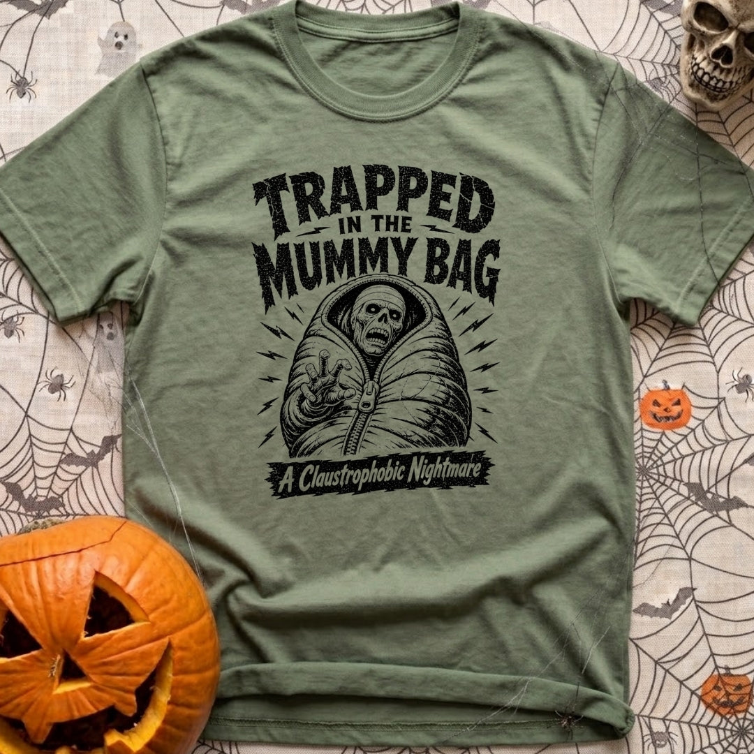 Rest In Fleece - T-Shirt in Moss - A black and white illustration of an undead skeleton trapped inside a zipped-up mummy...