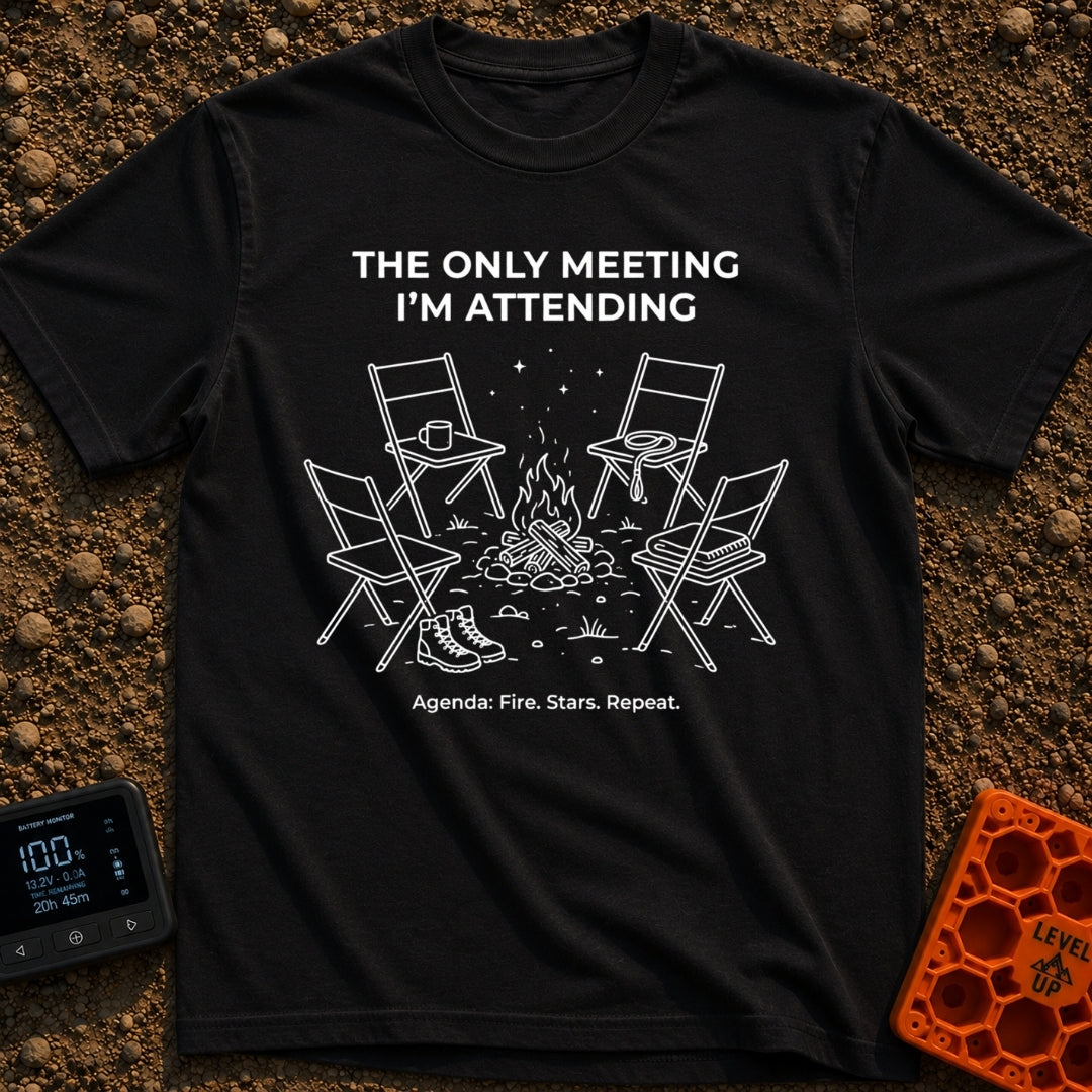 My Only Meeting - T-Shirt in Black - A white line illustration of four empty camp chairs arranged around a campfire under...