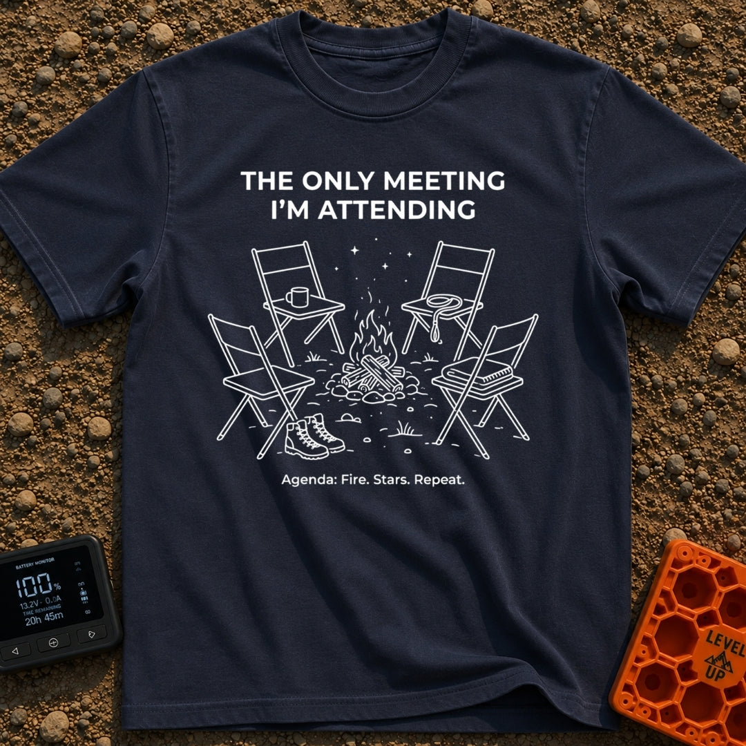 My Only Meeting - T-Shirt in Navy - A white line illustration of four empty camp chairs arranged around a campfire under...