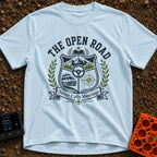Roads Over Meetings - T-Shirt in Chambray - A heraldic crest design featuring a mountain range with pine trees, a...