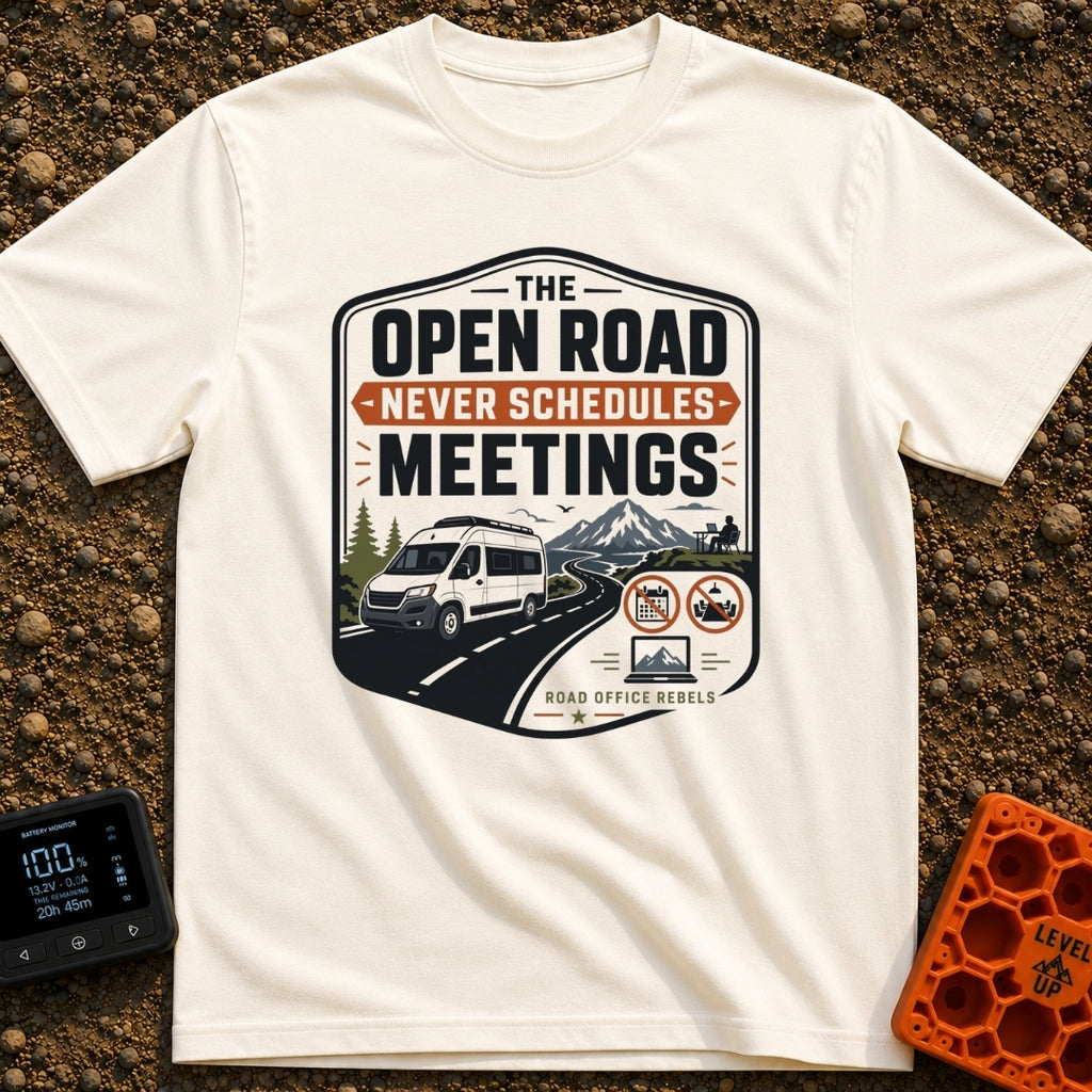 Roadtrips Not Meetings - T-Shirt in Ivory - A crest-style design featuring a white camper van driving on a mountain road...
