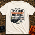 Roadtrips Not Meetings - T-Shirt in Ivory - A crest-style design featuring a white camper van driving on a mountain road...