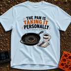 Skillet's Grudge Match - T-Shirt in Chambray - An illustration of a cast iron skillet holding a severely burnt pancake,...