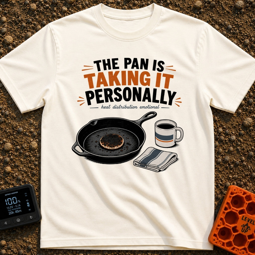 Skillet's Grudge Match - T-Shirt in Ivory - An illustration of a cast iron skillet holding a severely burnt pancake,...