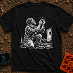 In Bubble We Trust - T-Shirt in Black - A white line-art illustration showing a bearded man kneeling beside a camper...