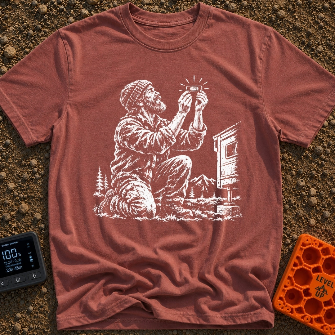 In Bubble We Trust - T-Shirt in Brick - A white line-art illustration showing a bearded man kneeling beside a camper...