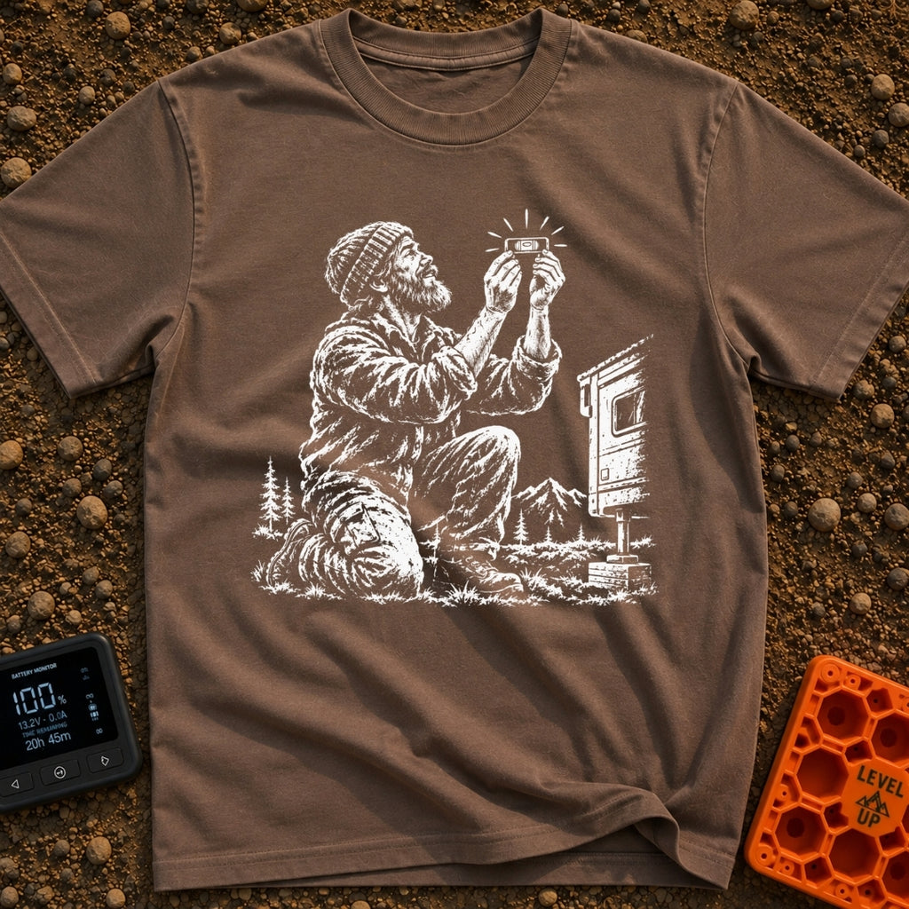 In Bubble We Trust - T-Shirt in Espresso - A white line-art illustration showing a bearded man kneeling beside a camper...