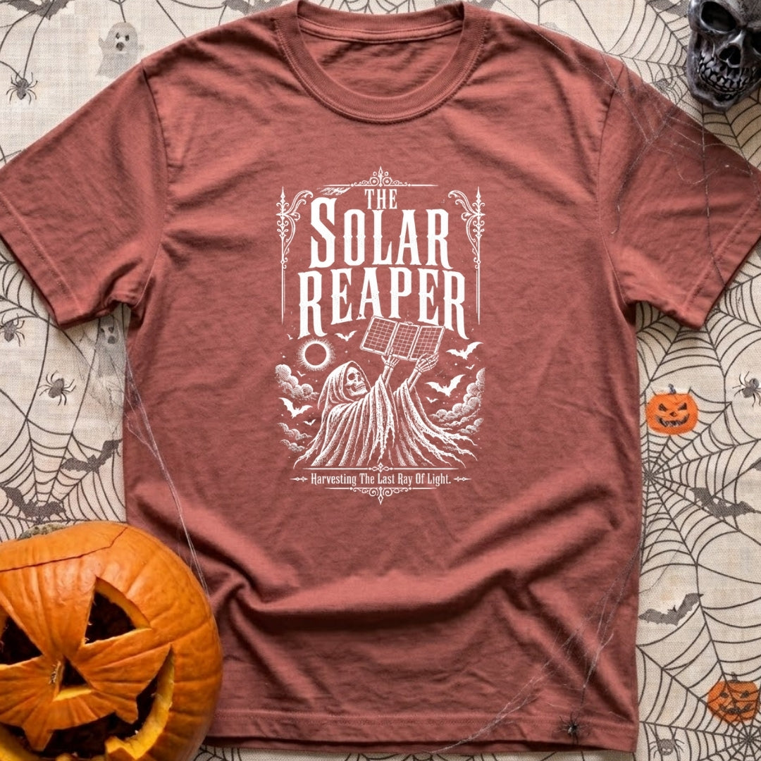 Reap What You Sun - T-Shirt in Brick - A black-and-white, vintage-style illustration of the Grim Reaper holding a folding...
