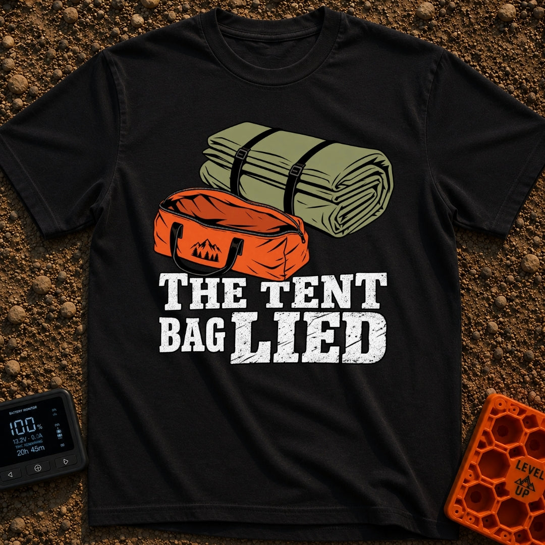 The Tent Bag Lied - T-Shirt in Black - A graphic showing a large rolled-up green tent sitting next to a noticeably...