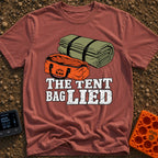 The Tent Bag Lied - T-Shirt in Brick - A graphic showing a large rolled-up green tent sitting next to a noticeably...