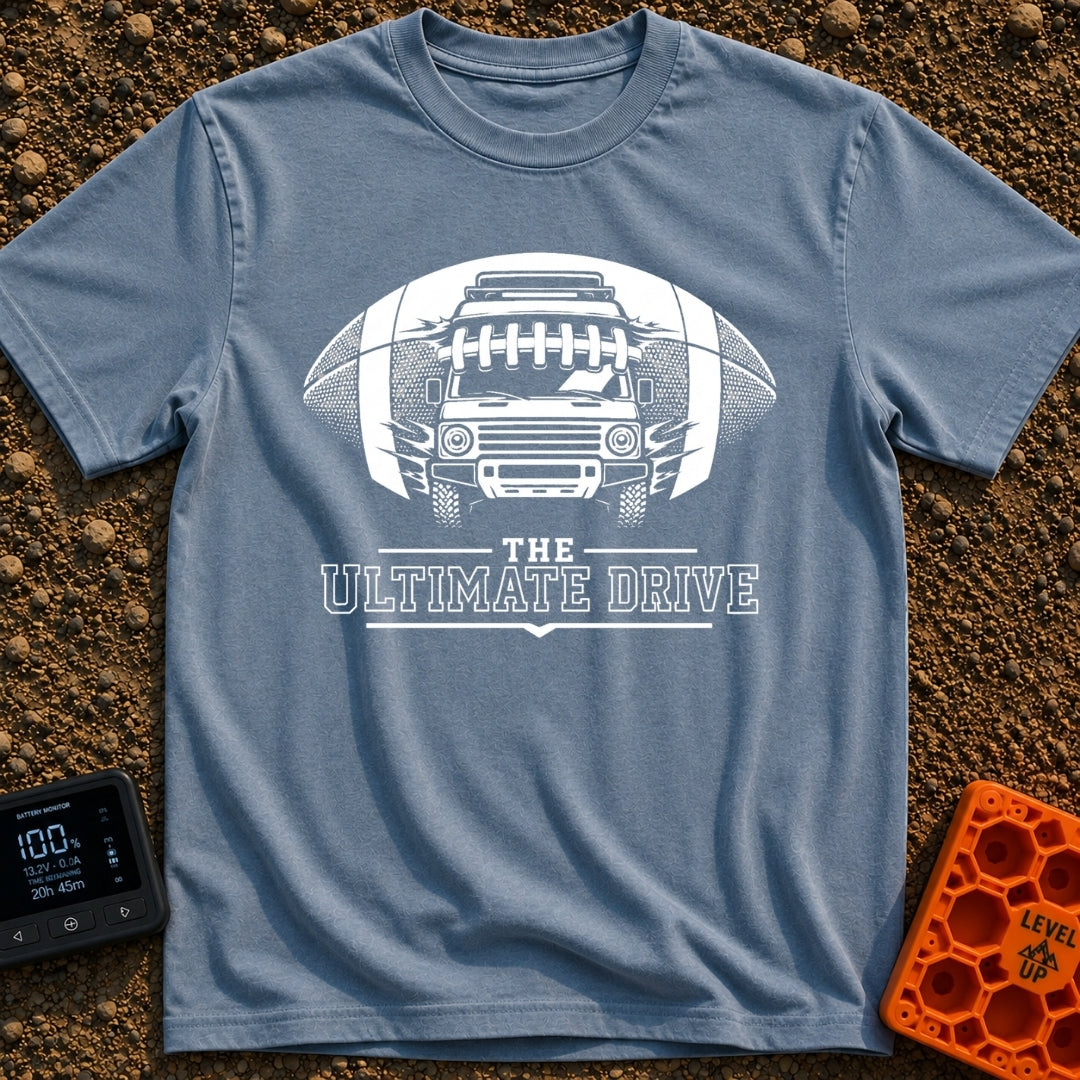 The Ultimate Drive - T-Shirt in Blue Jean - A black and white illustration of a camper van breaking through the center of...