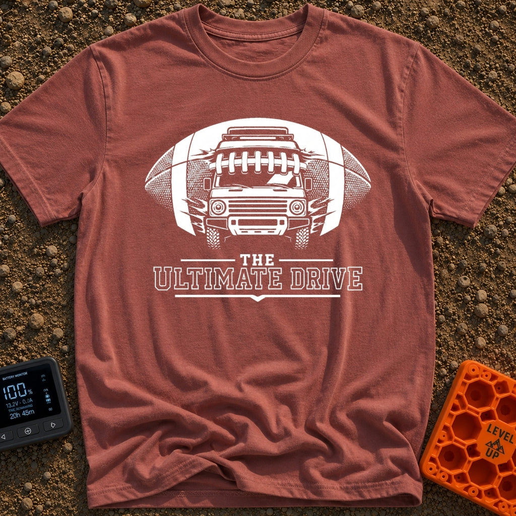 The Ultimate Drive - T-Shirt in Brick - A black and white illustration of a camper van breaking through the center of a...