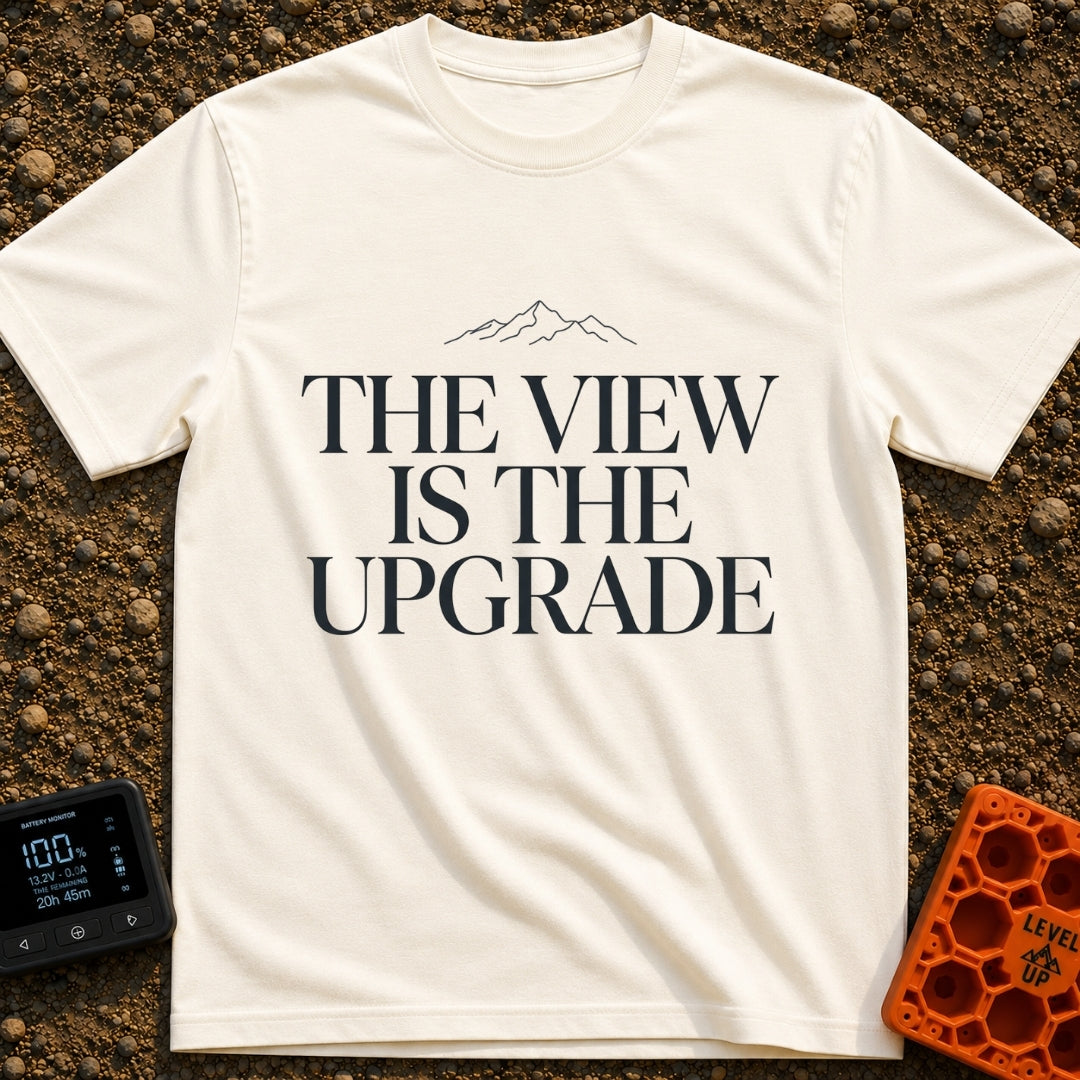Upgrade To The View - T-Shirt in Ivory - A minimalist, text-focused design featuring the stacked phrase "THE VIEW IS THE...
