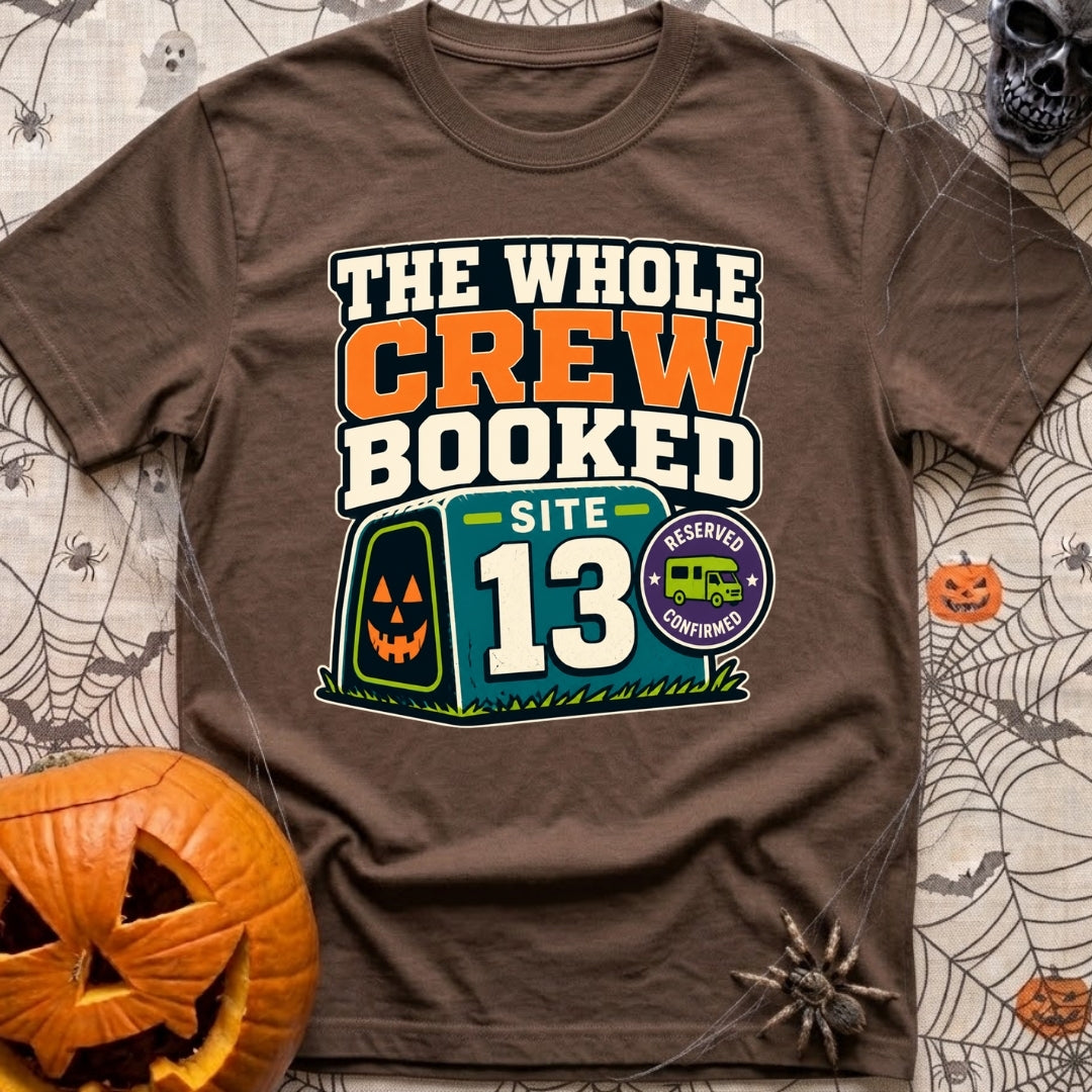 The Whole Crew Booked - T-Shirt in Espresso - A typographic design reading 'THE WHOLE CREW BOOKED', above a teal campsite...
