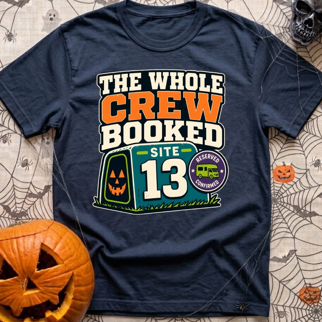 The Whole Crew Booked - T-Shirt in Navy - A typographic design reading 'THE WHOLE CREW BOOKED', above a teal campsite...