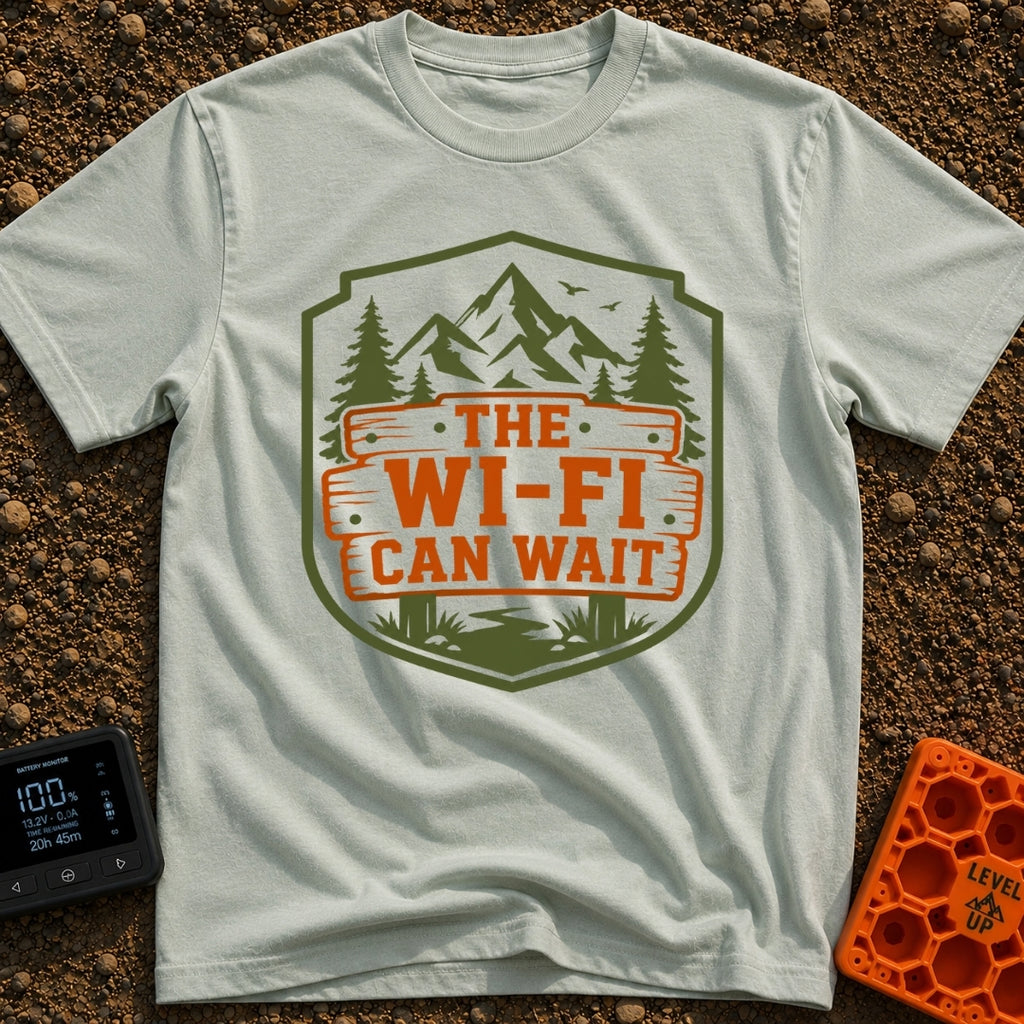Mountains Over Modems - T-Shirt in Bay - A badge-shaped graphic featuring green mountains, pine trees, and a winding...