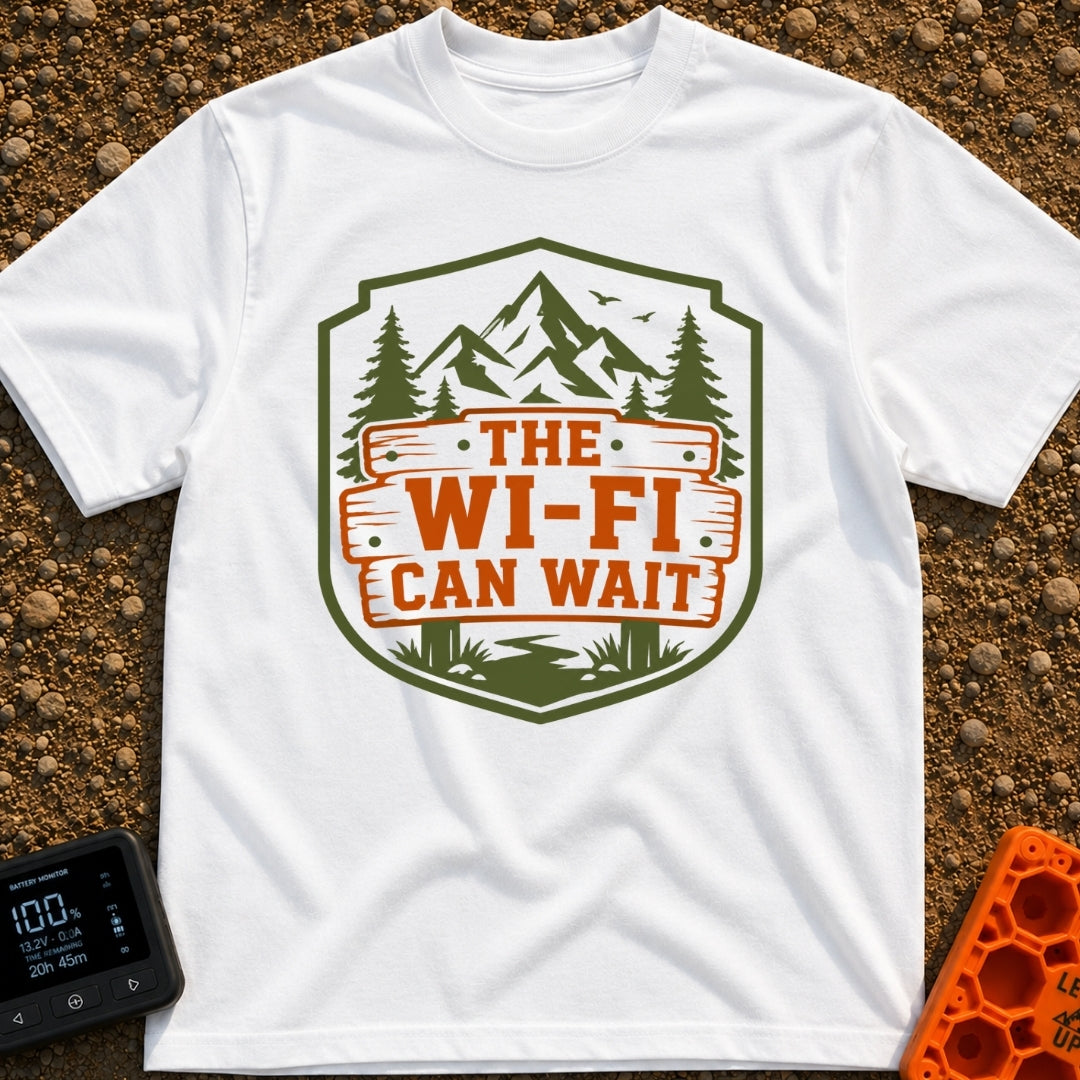 Mountains Over Modems - T-Shirt in White - A badge-shaped graphic featuring green mountains, pine trees, and a winding...
