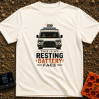 Resting Battery Face - T-Shirt in Ivory - A front-facing illustration of a camper van with a roof-mounted solar panel and...