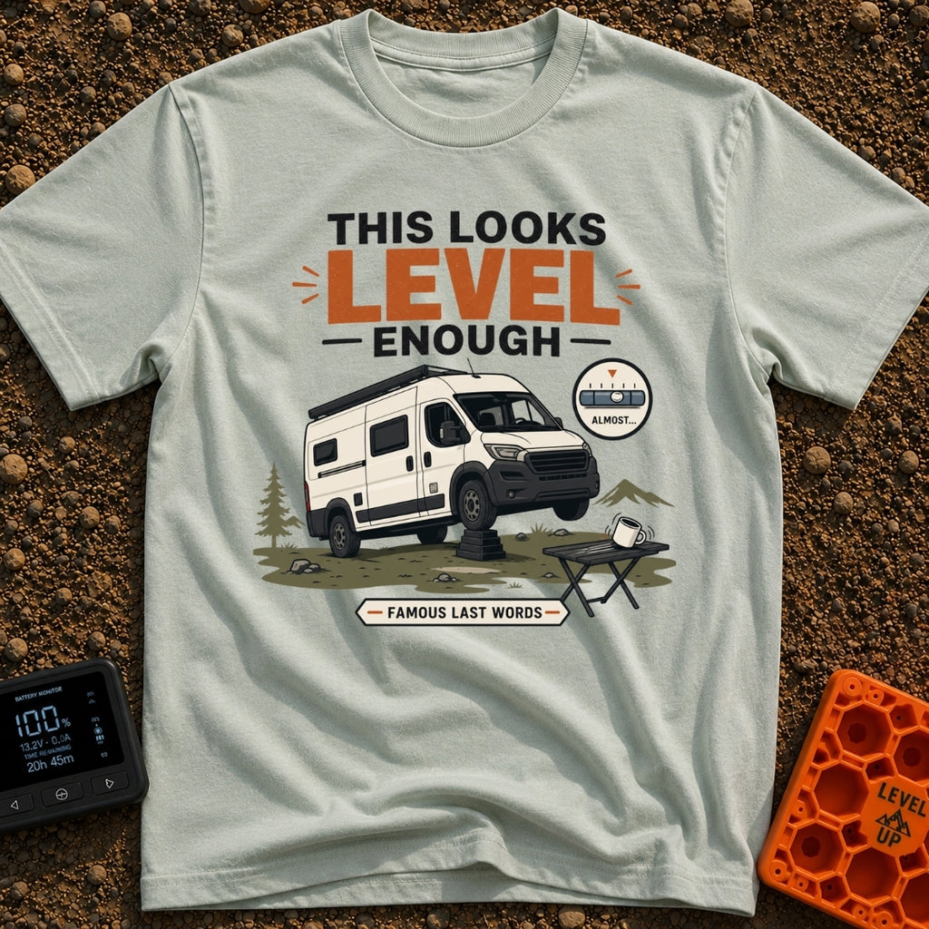 Leaning Tower Camper - T-Shirt in Bay - A cartoon illustration of a white camper van parked on uneven terrain with its...