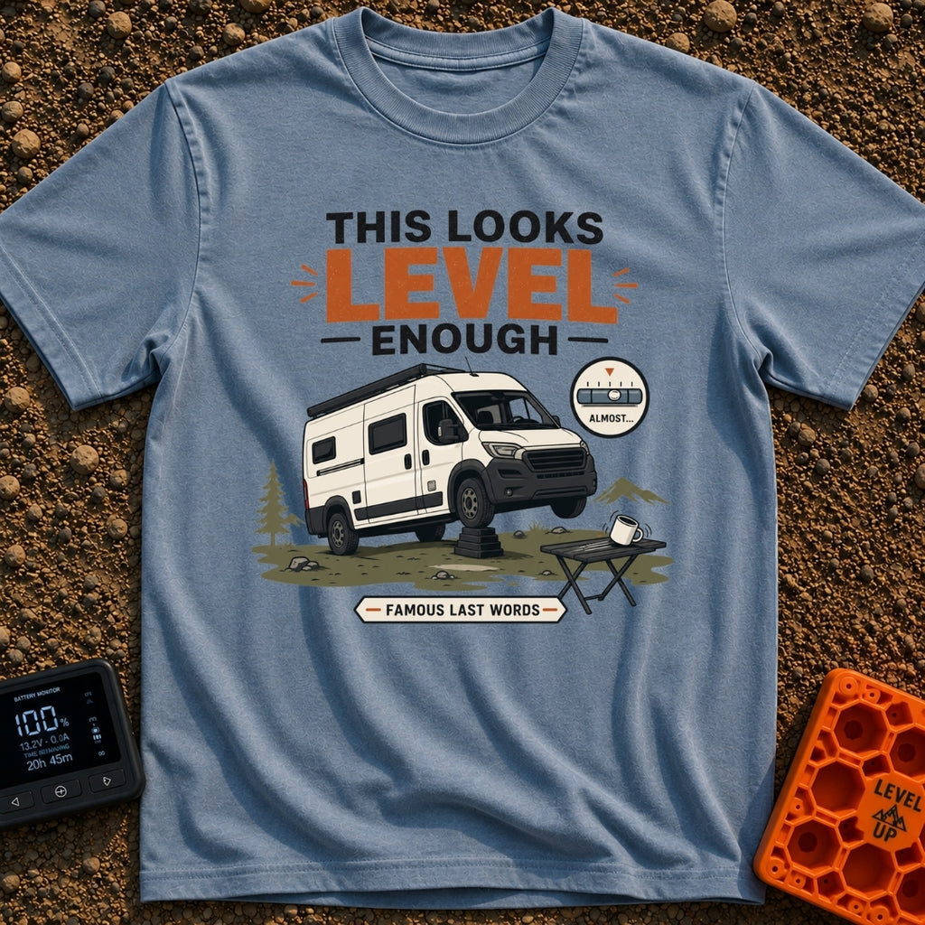 Leaning Tower Camper - T-Shirt in Blue Jean - A cartoon illustration of a white camper van parked on uneven terrain with...