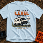 Leaning Tower Camper - T-Shirt in Chambray - A cartoon illustration of a white camper van parked on uneven terrain with...