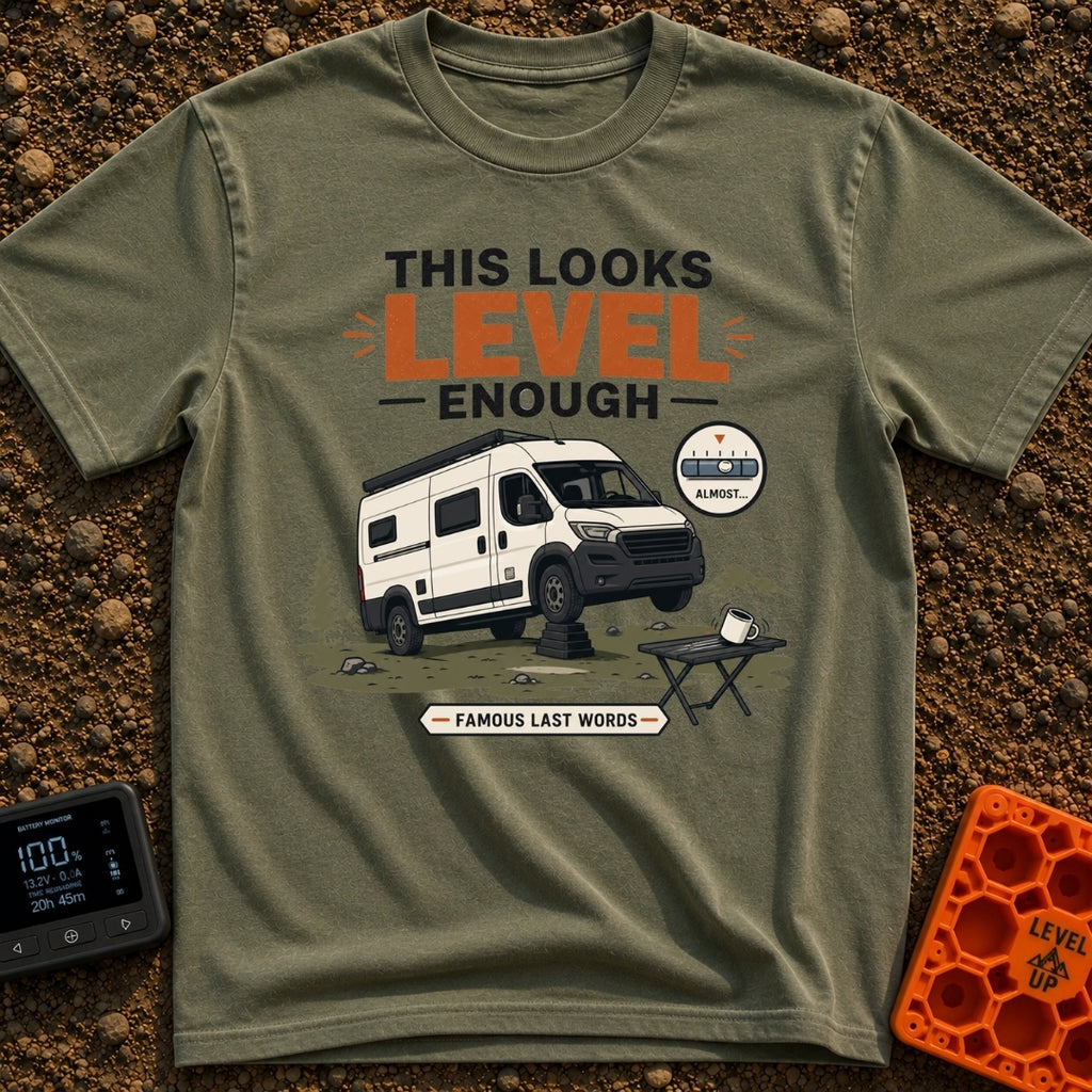 Leaning Tower Camper - T-Shirt in Moss - A cartoon illustration of a white camper van parked on uneven terrain with its...