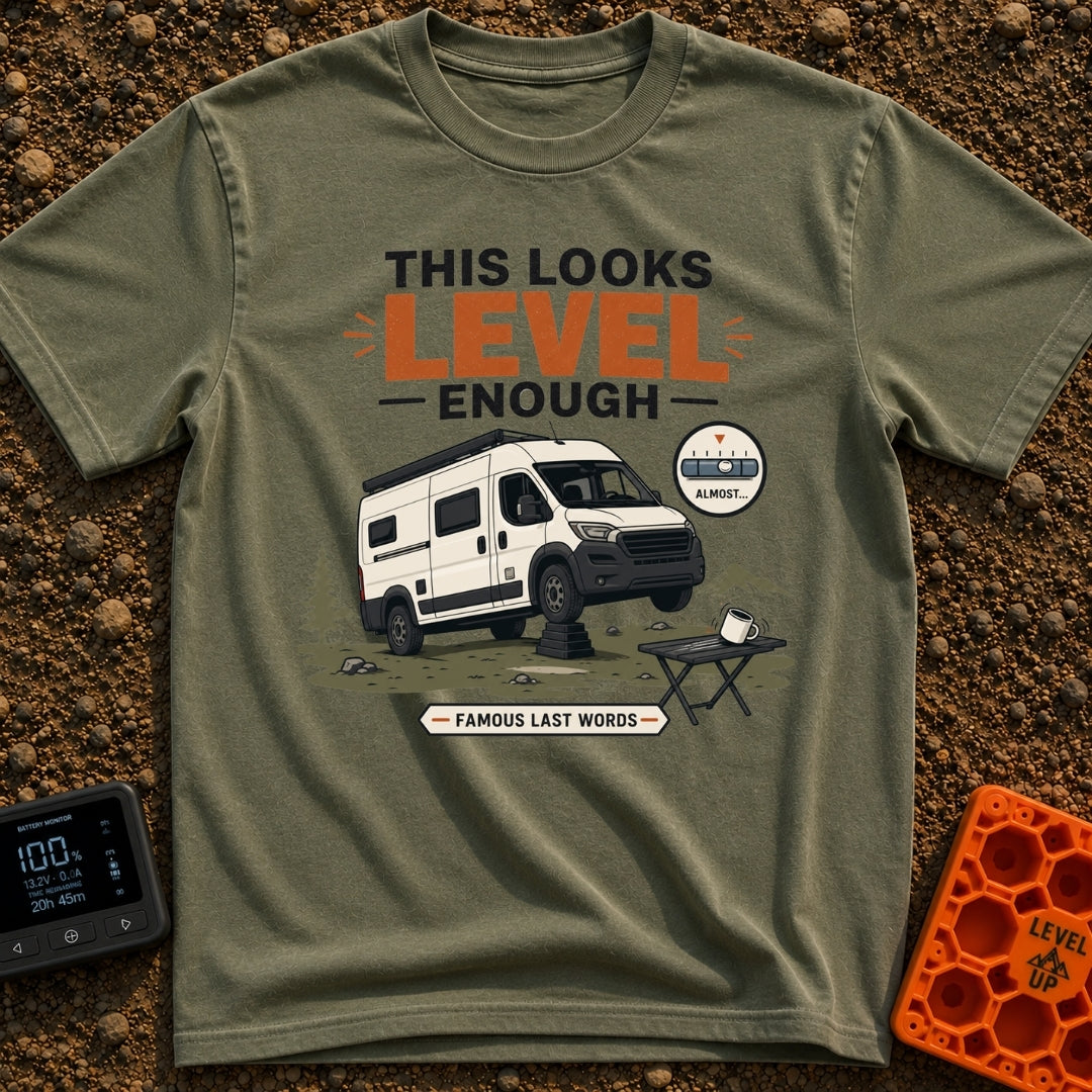 Leaning Tower Camper - T-Shirt in Moss - A cartoon illustration of a white camper van parked on uneven terrain with its...