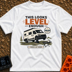 Leaning Tower Camper - T-Shirt in White - A cartoon illustration of a white camper van parked on uneven terrain with its...