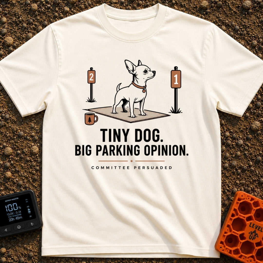 Pint-Sized Parking Critic - T-Shirt in Ivory - An illustration of a small dog standing on an outdoor mat between two...