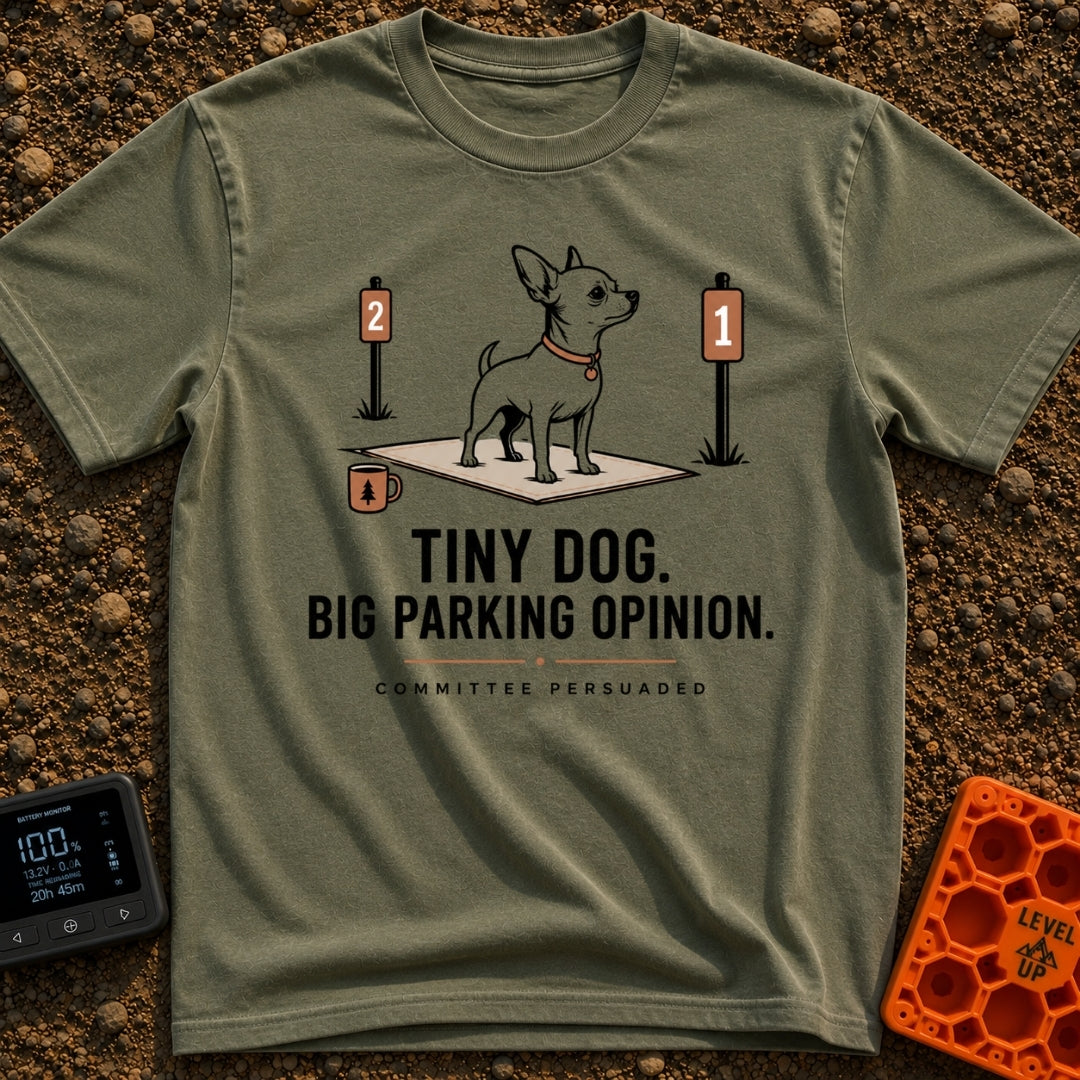 Pint-Sized Parking Critic - T-Shirt in Moss - An illustration of a small dog standing on an outdoor mat between two...