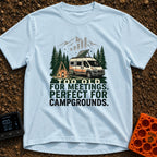 Too Old For Meetings - T-Shirt in Chambray - A camper van with a tilted solar panel on its roof parked next to a green...